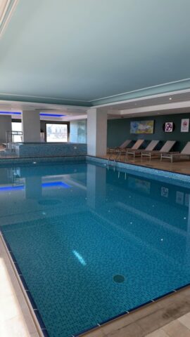 Spacious indoor swimming pool with loungers. Perfect for relaxation and leisure.